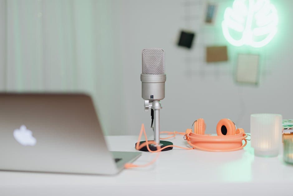 Podcast recording setup with headphones and desk